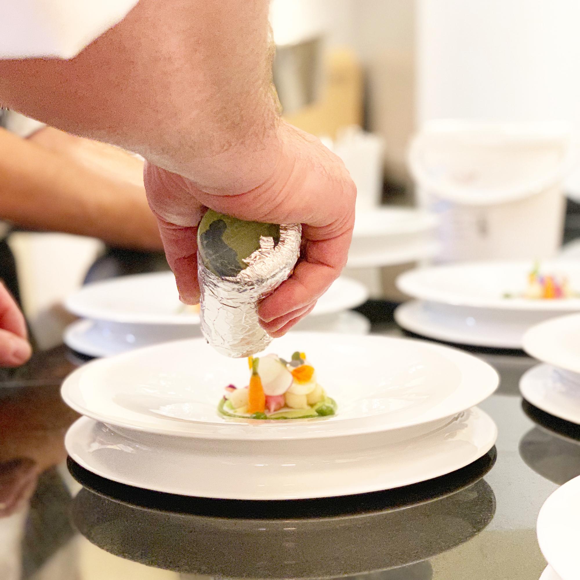 Instructor arranging plated tasting menu